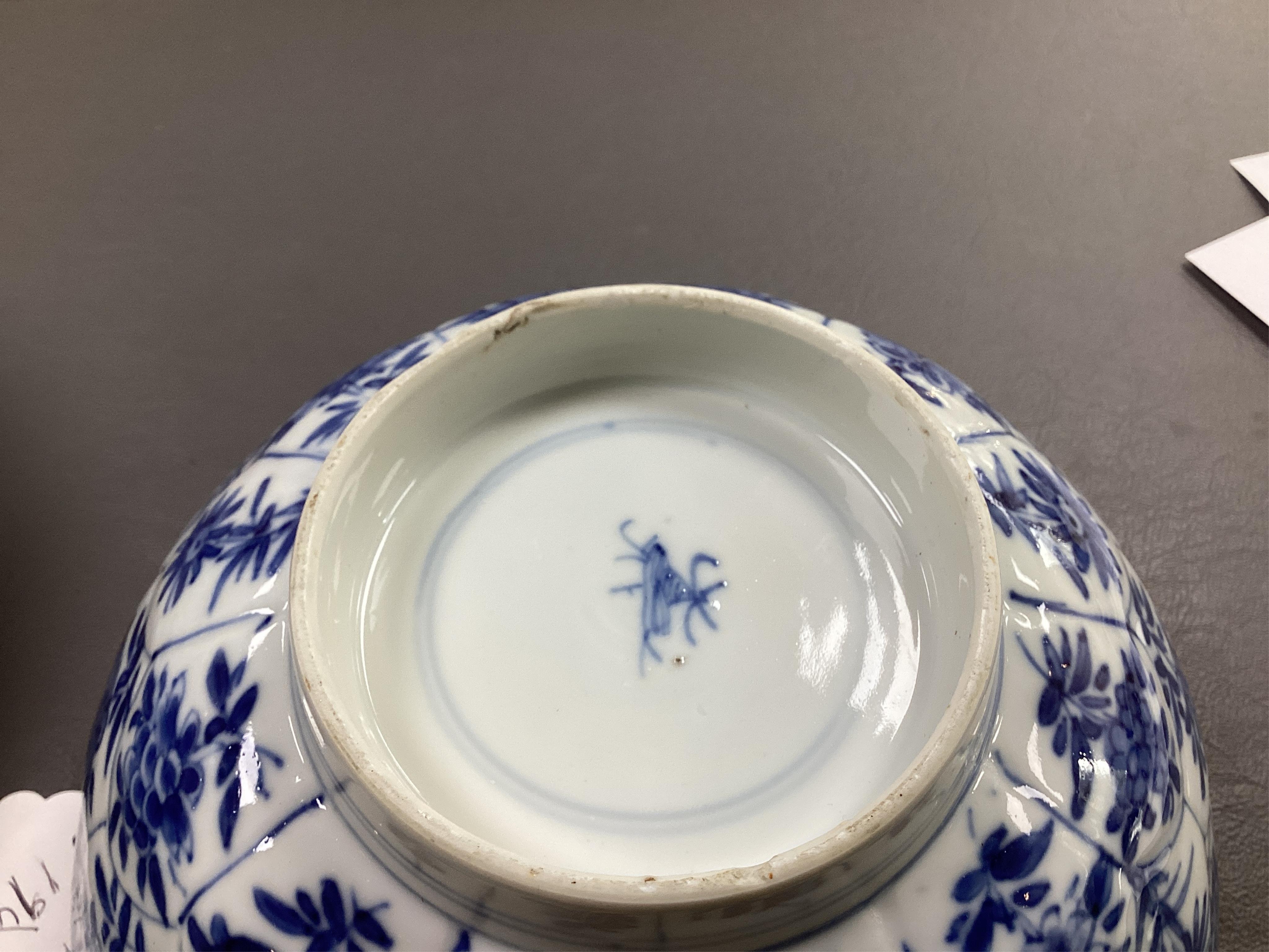 A near pair of Chinese blue and white lotus flower moulded bowls, Kangxi period